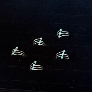 Chic Silver Rings with Turquoise Accents
Each